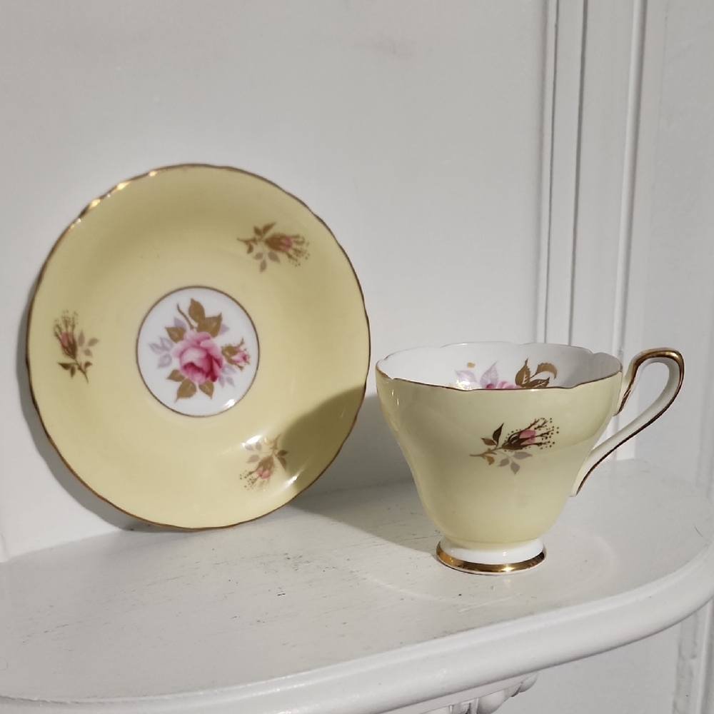 This is a vintage H & M Sutherland bone china in a pale yellow England